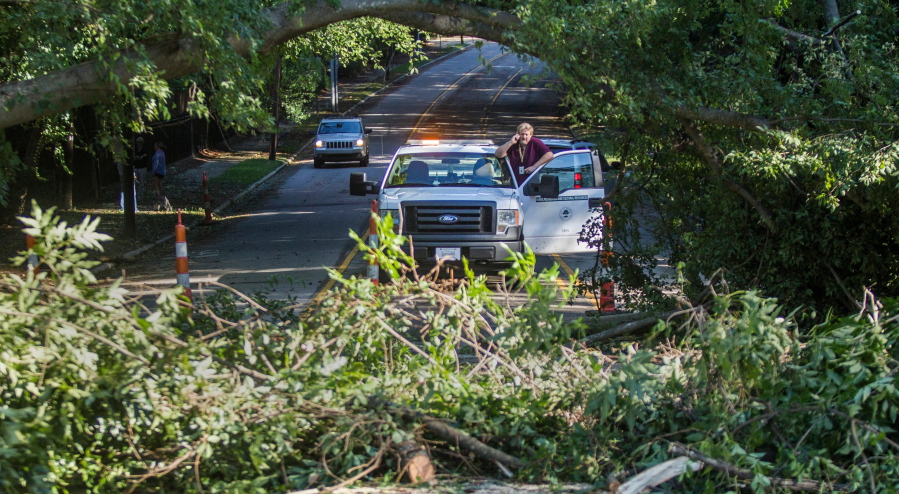 A downed tree blocks traffic on Lassiter Mill Road in Raleigh, N.C., after Hurricane Matthew caused downed trees and flooding Sunnday. Hurricane Matthew&#039;s torrential rains triggered severe flooding in North Carolina on Sunday as the deteriorating storm made its exit to the sea, and thousands of people had to be rescued from their homes and cars.