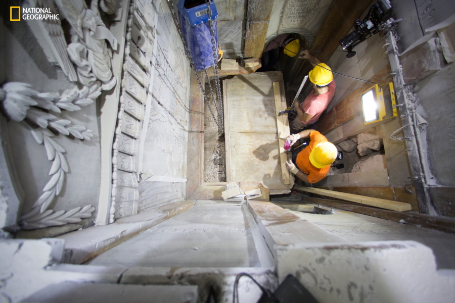 Workers remove the top marble layer of the tomb said to be that of Jesus Christ on Wednesday in the Church of Holy Sepulchre in Jerusalem.