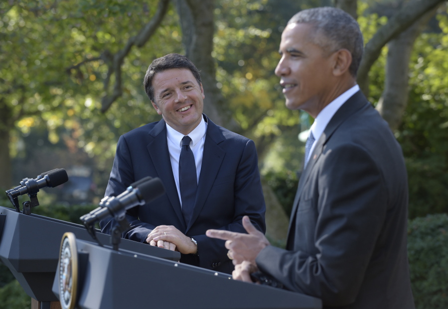 Italian Prime Minister Matteo Renzi listens as President Barack Obama speaks during their news conference in the Rose Garden of the White House in Washington on Tuesday, Oct. 18, 2016.