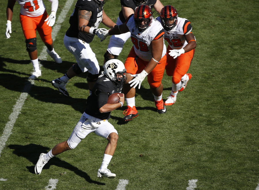 Colorado quarterback Jordan Gehrke (7) runs for a 23 yard gain during successful touchdown drive against Oregon State during the second half of an NCAA college football game in Boulder, Colo., Saturday, Oct. 1, 2016. Colorado won, 47-6.