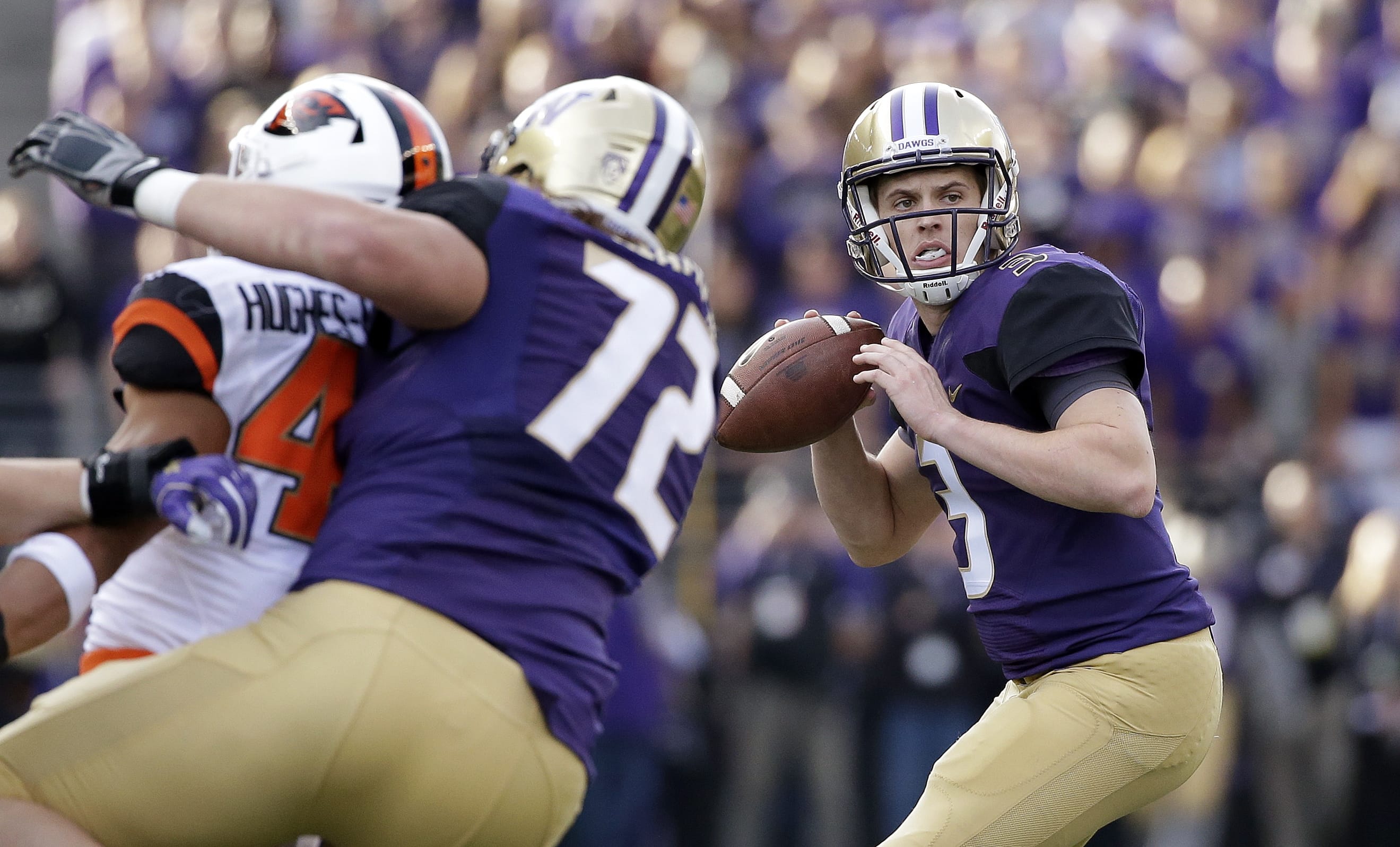 Washington quarterback Jake Browning drops back to throw a pass that led to a touchdown against Oregon State in the minutes of an NCAA college football game Saturday, Oct. 22, 2016, in Seattle.