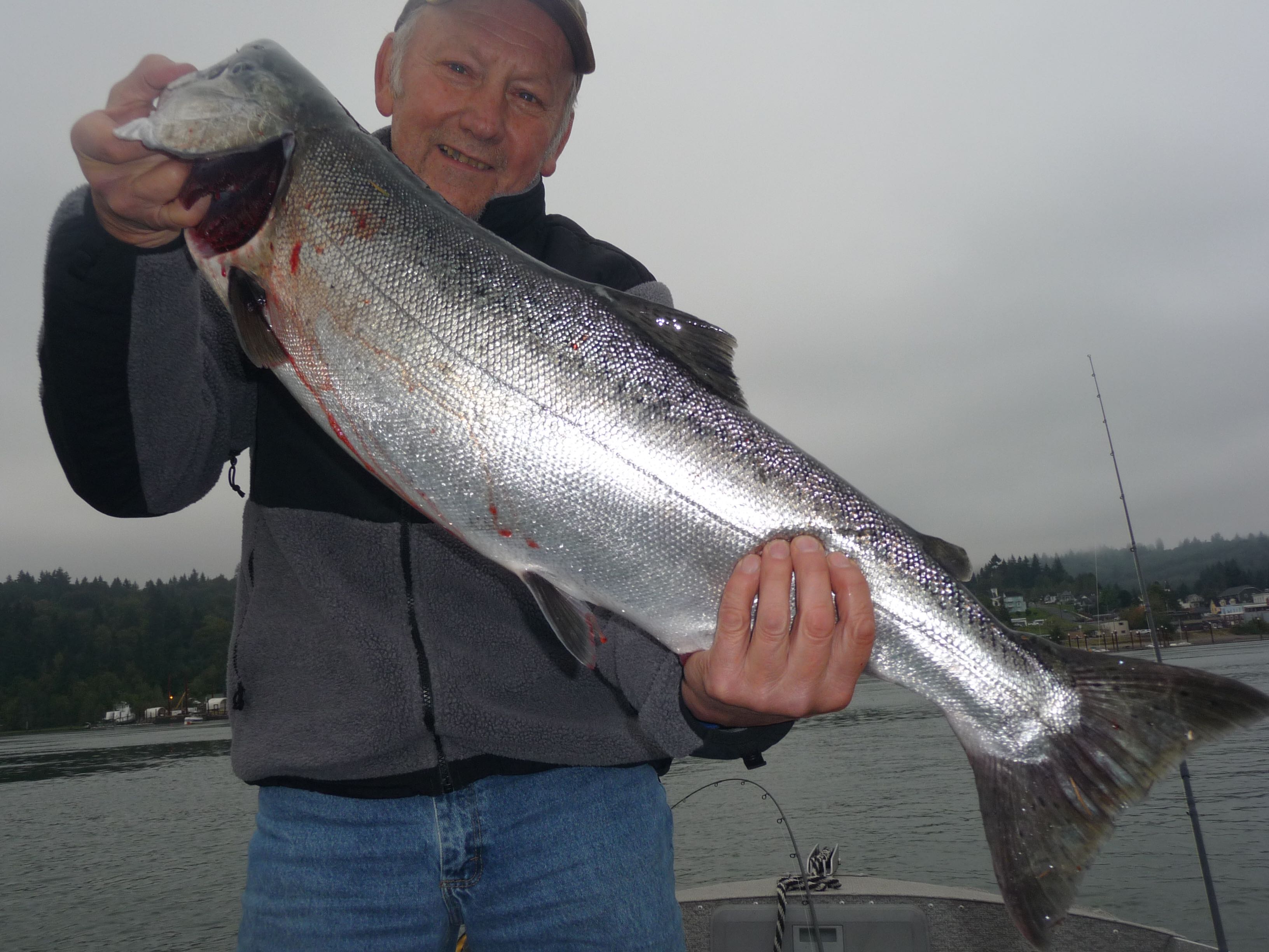 Richard Borneman of Vancouver holds a chinook he caught in the Columbia River near Rainier, Ore.