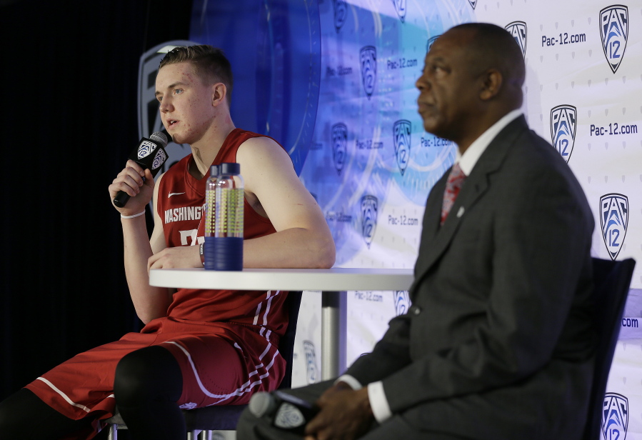 Washington State forward Josh Hawkinson, left, answers questions as head coach Ernie Kent, right, listens during NCAA college basketball Pac-12 media day Friday, Oct. 21, 2016, in San Francisco.
