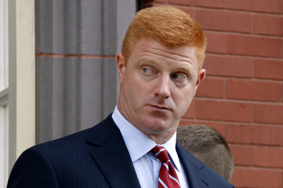 FILE - In this Oct. 17, 2016, file photo, former Penn State University assistant football coach Mike McQueary leaves the Centre County Courthouse Annex for lunch in Bellefonte, Pa. Lawyers for the former Penn State assistant football coach are urging jurors to find the university liable for how it treated him after it became public that his testimony helped prosecutors charge Jerry Sandusky with child molestation. Both sides in the defamation and whistleblower lawsuit filed by McQueary made closing arguments Thursday, Oct. 27. (AP Photo/Gene J.