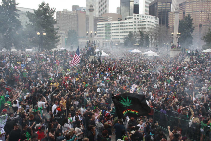 Members of a crowd numbering tens of thousands smoke marijuana at the Denver 4/20 pro-marijuana rally at Civic Center Park in Denver on April 20, 2013. Denver police have said they would potentially use social media tracking software like Geofeedia to monitor the annual gathering. Increasingly common tools that allow police to conduct real-time social media surveillance during protests are drawing criticism from civil liberties advocates, who oppose the way some departments have quietly unrolled the technology without community input and little public explanation.