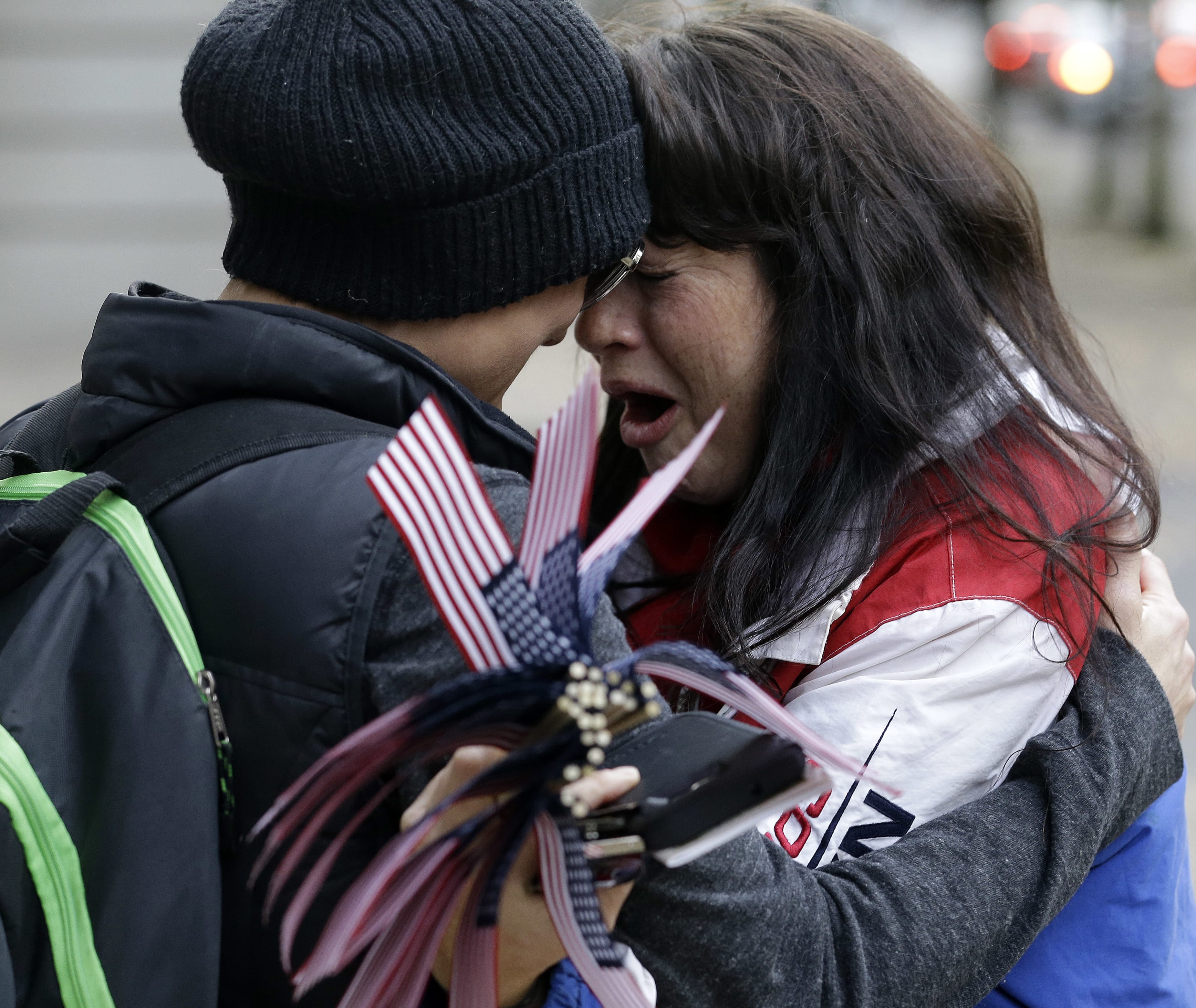 Maureen Valdez, right, cries and hugs another supporter after hearing a verdict outside federal court in Portland, Ore., Thursday, Oct. 27, 2016. A jury exonerated brothers Ammon and Ryan Bundy and five others of conspiring to impede federal workers from their jobs at the Malheur National Wildlife Refuge.