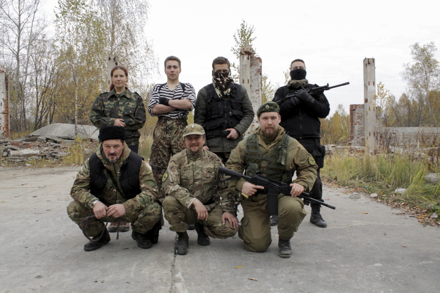 Participants pose with Kalashnikovs at an ultra-nationalist &quot;war camp&quot; on the outskirts of Moscow, Russia. Camps such as these have been on the rise in Russia, with some serving as breeding grounds for the volunteers who fought with Russia-backed separatists in eastern Ukraine.