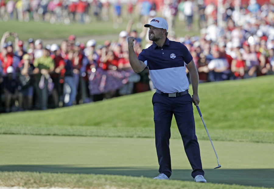 United States' Ryan Moore reacts after winning the 17th hole during a singles match at the Ryder Cup golf tournament Sunday, Oct. 2, 2016, at Hazeltine National Golf Club in Chaska, Minn.