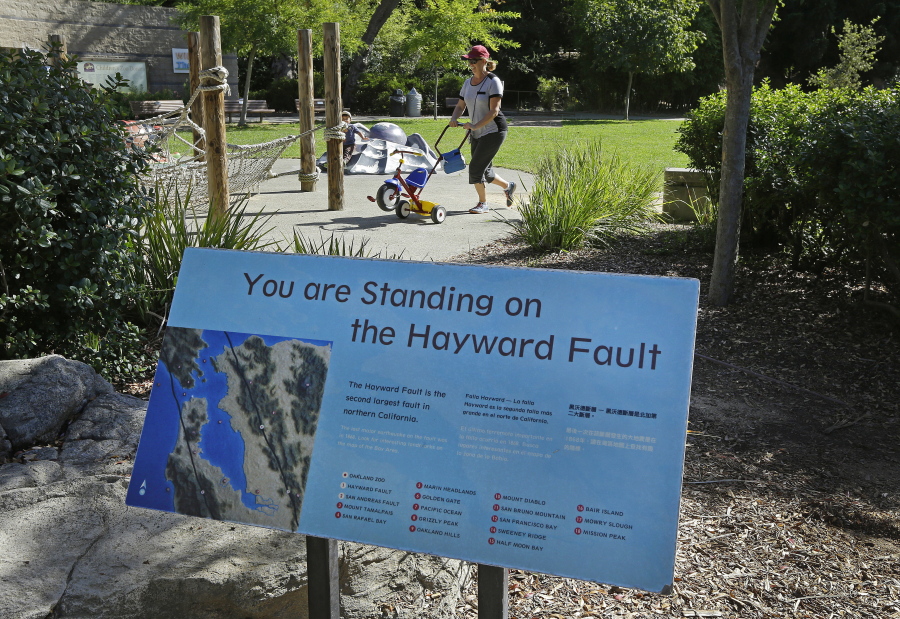 A sign notifying people they are standing on the Hayward Fault stands at the children&#039;s zoo area at the Oakland Zoo in Oakland, Calif. New research published in the journal Science Advances on Wednesday found that the Hayward Fault may be linked to another fault.