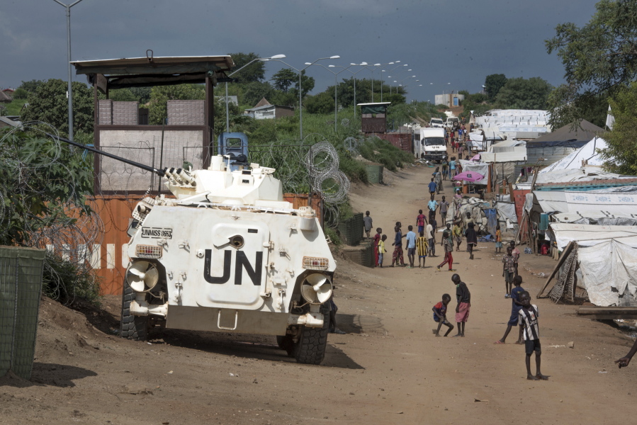 A United Nations armoured personnel vehicle stands in a refugee camp in Juba South Sudan. A new report says United Nations peacekeepers fled their posts when fighting erupted in South Sudan&#039;s capital in July, then used tear gas on frightened civilians who sought shelter within the U.N. base. The report on Wednesday, Oct.