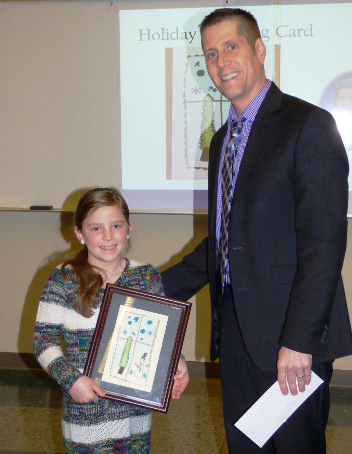 Ridgefield: South Ridge Elementary School third-grader Emma Waddle and Ridgefield School District Superintendent Nathan McCann celebrating Emma&#039;s win in last year&#039;s annual holiday greeting card contest. Submissions for this year&#039;s contest are due Nov.
