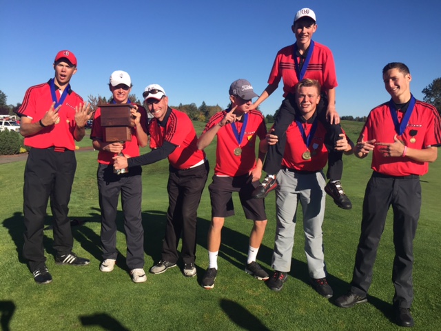 Members of the Union High School golf team celebrate their district title title on Tuesday (Paul Valencia/The Columbian)