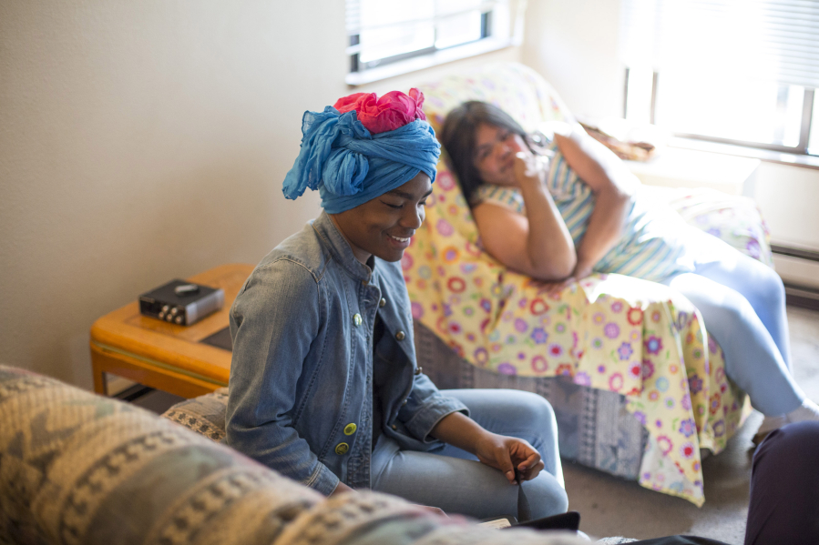 Marci Owens uses a computer while chatting with her grandmother, Gina Owens, at their Seattle home. Owens, who is transgender, gained fame in 2010 as an attendee of the Affordable Care Act&#039;s signing.