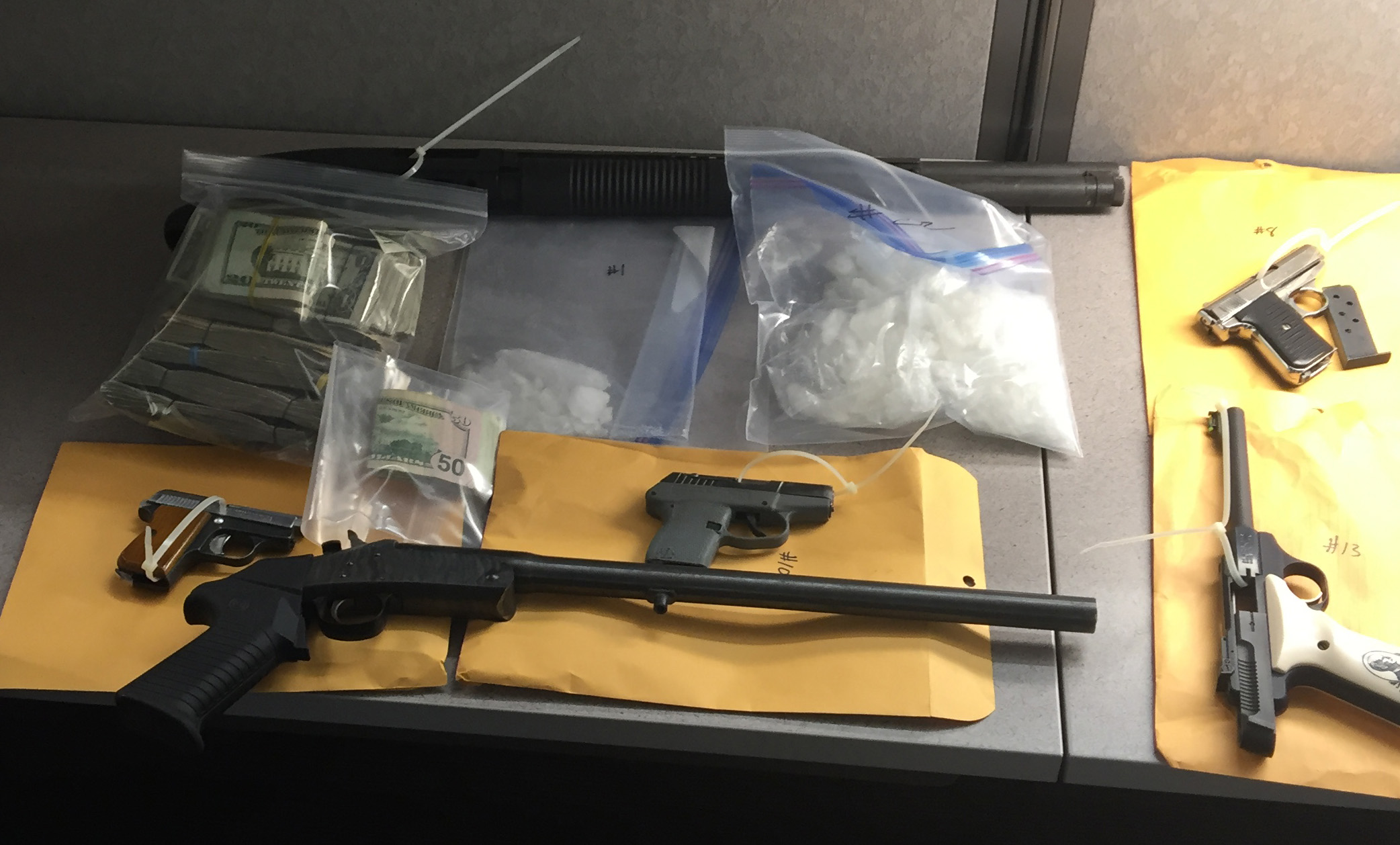 Law enforcement officers recovered more than 3 pounds of methamphetamine, some heroin and multiple illegally-owned firearms after two searches of the same man at the same Image neighborhood house this month.