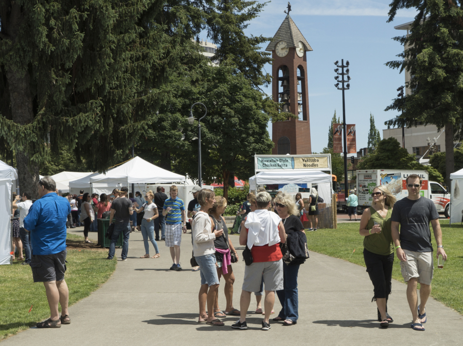 Visitors walk through Esther Short Park during The Craft Beer and Wine Fest of Vancouver this summer. An estimated 3,500 people attended the event. The park, once an unpleasant place to be, is an increasingly popular community venue.