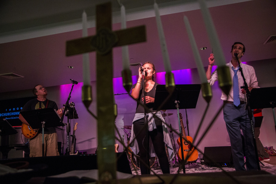 From left, Vander Warner, Taylor Meadows and TomTom Roach rehearse Tuesday evening, Sept. 14, 2016 during a band practice at the Church on Morgan in downtown Raleigh, N.C. Church on Morgan has a thriving number of millennials in its congregation.