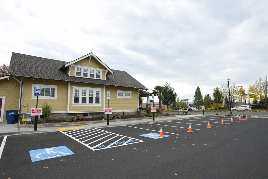 Cones and towing signs line the shared parking lot of the real estate office of Terrie Cox and Chick-fil-A on Southeast Mill Plain Boulevard.