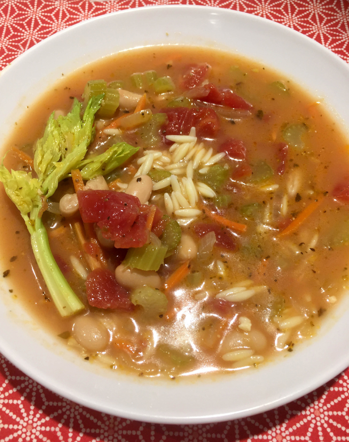 Hearty minestrone with Celery and Parmesean-Reggiano, which has a sharper flavor than Parmesan and more of a granular or grainy texture.