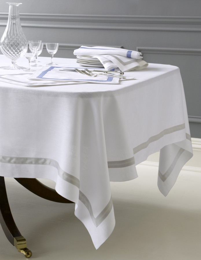A table with a Matouk cloth shows the correct length drop.