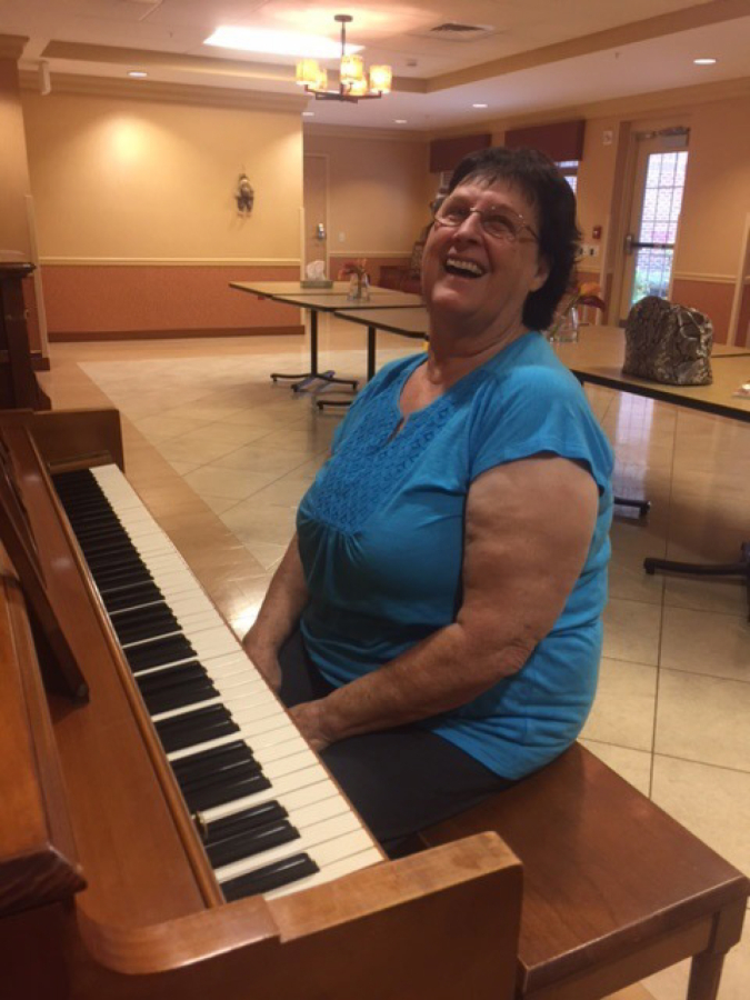 Salmon Creek: Eileen Kammer, a patient at ManorCare Services, using a new piano donated to the center through the School of Piano Technology for the Blind?s Piano Adoption Program.