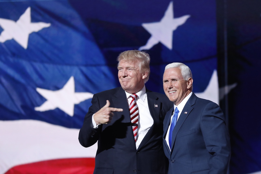 Republican presidential candidate Donald Trump, points toward Republican Vice presidential candidate Gov. Mike Pence of Indiana after Pence&#039;s acceptance speech during the third day session of the Republican National Convention in Cleveland, Wednesday, July 20, 2016.