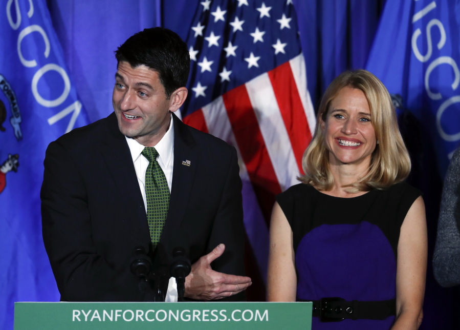 House Speaker Paul Ryan of Wisconsin smiles with his wife Janna at a campaign rally in Janesville, Wis., Tuesday, Nov. 8, 2016.