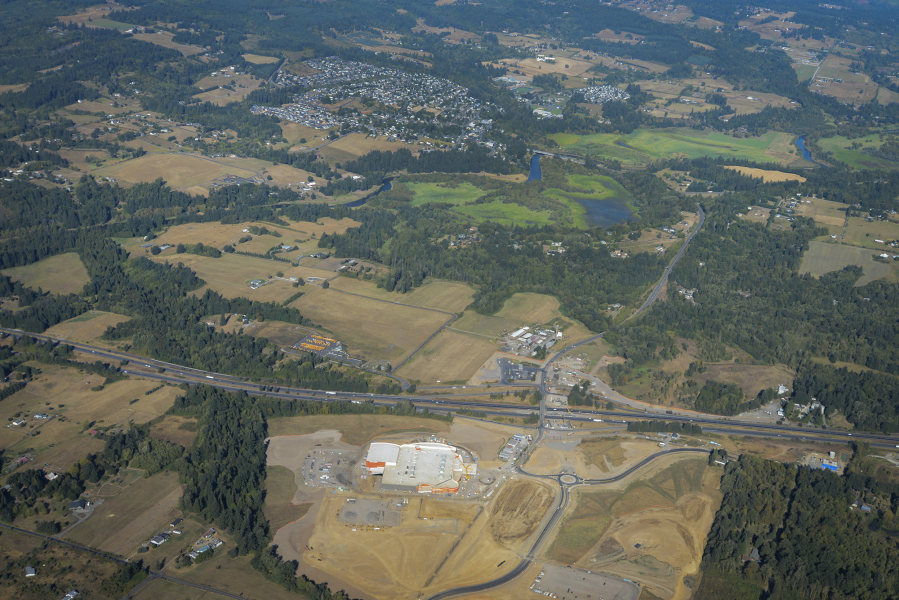 The city of La Center, top, is shaping plans and principles for development around its Interstate 5 junction, where $32 million in improvements is coming as part of the Cowlitz Tribe&#039;s construction of the Ilani Casino Resort, bottom, as seen Aug. 25.