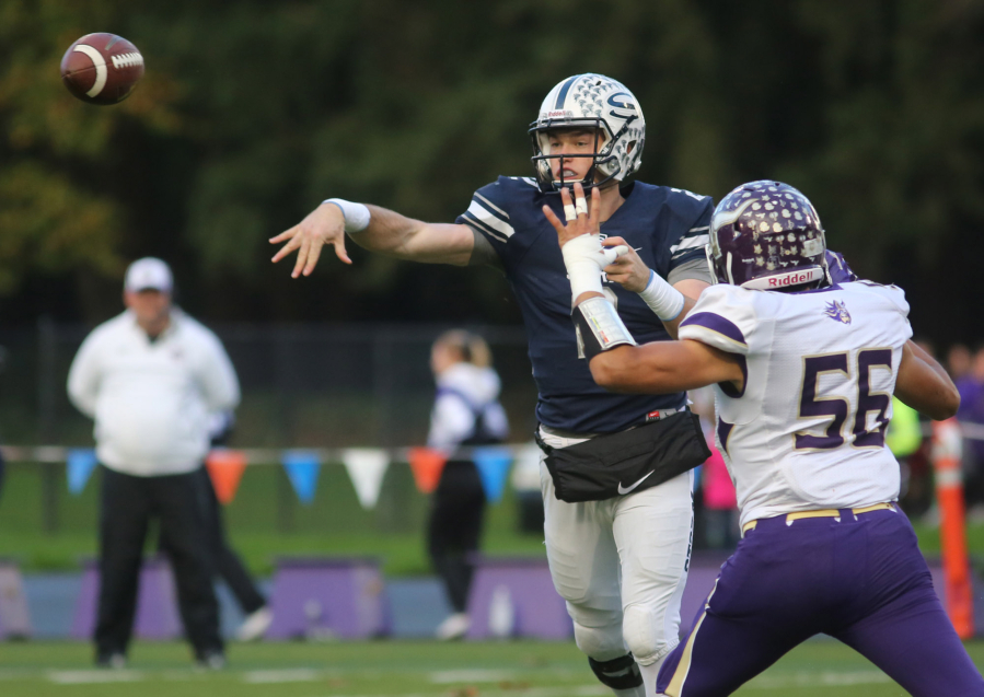 Skyview&#039;s Brody Barnum throws the ball as  Lake Stevens&#039;  Matt Sevao tries to intercept in the football 4A state quarterfinals at Kiggins Bowl in Vancouver Saturday November 19, 2016.