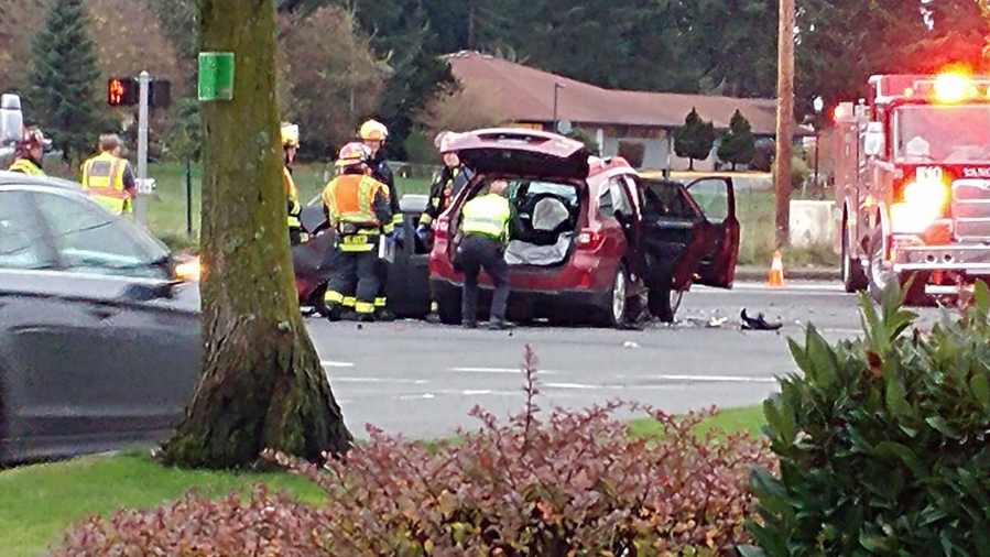 Police and fire personnel respond to a three-vehicle crash Wednesday afternoon in east Vancouver. An apparent medical problem sent one driver into oncoming traffic on Northeast 162nd Avenue, causing the crash.