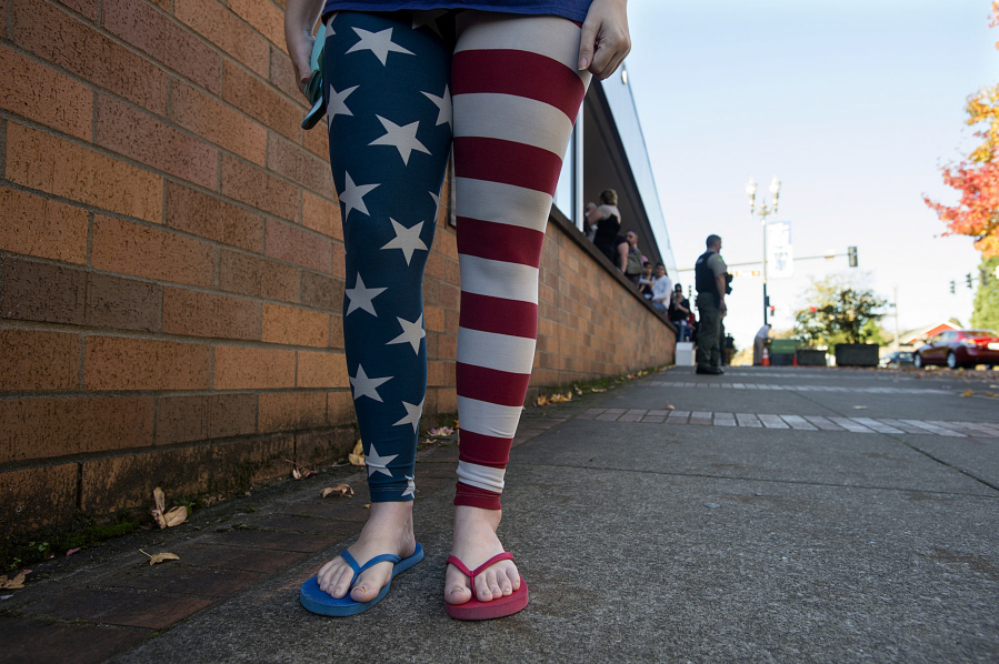 Vancouver resident Eliza Smith shows her patriotic spirit outside the Clark County Elections Office on Tuesday afternoon.