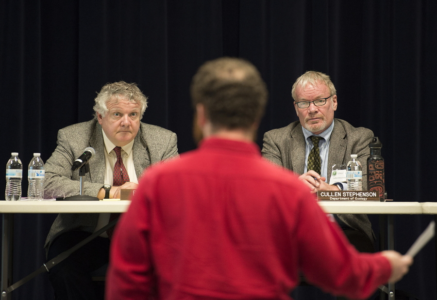 Energy Facility Site Evaluation Council members Bill Lynch, left, and Cullen Stephenson listen Tuesday as Ryan Rittenhouse of Friends of the Columbia Gorge speaks during a hearing on a Vancouver Energy permit.