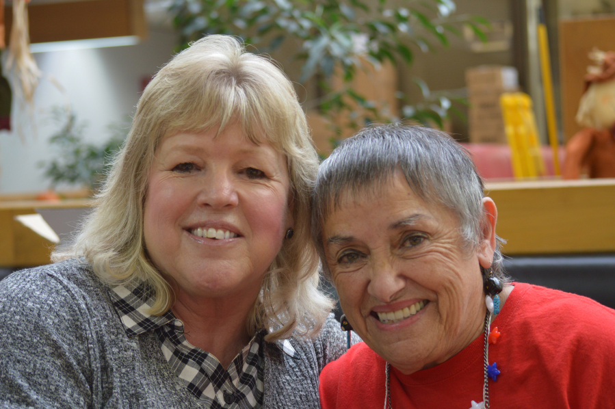 Vancouver&#039;s Joyce Corier and Julie Burger at a Red Cross veteran care package assembly event Friday. The two met, accidentally, months after Burger helped secure for Corier&#039;s active-duty son a trip home to see his dying father.