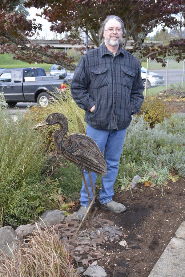 Washougal: Portland metal artist Tom Jackson and his &quot;Golden Back Heron&quot; sculpture, which was unveiled at Washougal City Hall on Nov.