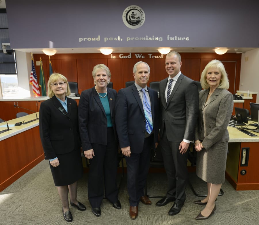 County council members Jeanne Stewart, Julie Olson, Marc Boldt, John Blom and Eileen Quiring gather after a county council meeting at the Clark County Public Service Building.