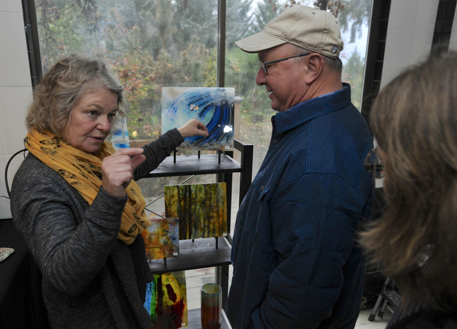 Ann Cavanaugh, left, speaks with visitors, including Jim Basler, center, on Sunday at her Battle Ground studio during the 2016 Clark County Open Studios tour. The weekendlong event allows the public to visit artists&#039; studios and observe them in action.