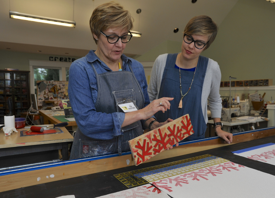 Deb Spofford, left, and her daughter Abi Spofford are on hand to welcome guests Sunday to the Felida-area studio during the 2016 Clark County Open Studios tour. Deb Spofford demonstrated how she block prints ink onto fabric.