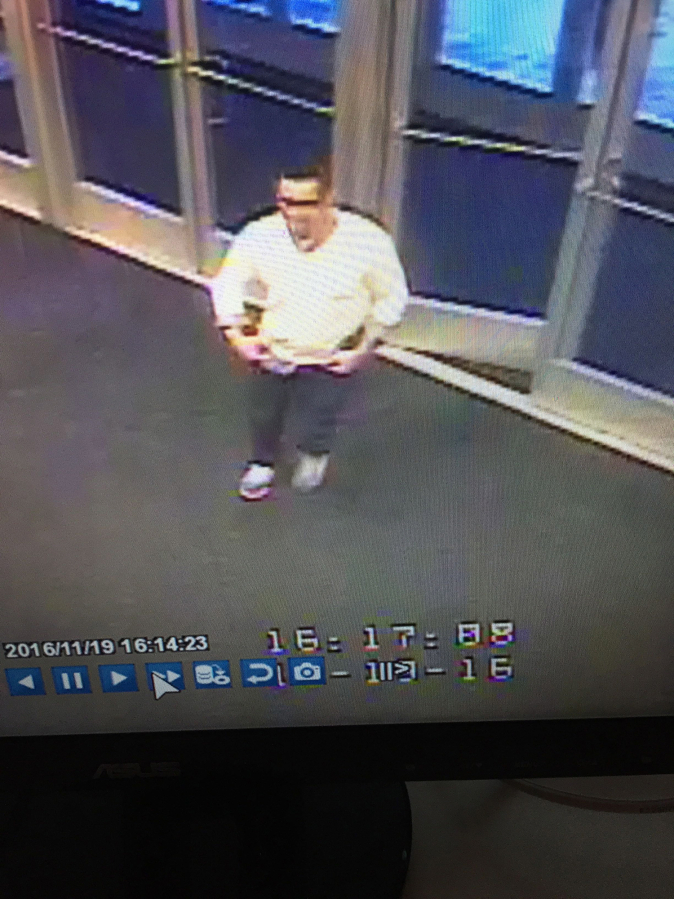 The Vancouver Police Department is looking for tips to help identify this man, shown in surveillance video taken from the Vancouver Mall Macy&#039;s, who allegedly stole a woman&#039;s engagement ring after he responded to her online ad selling it.