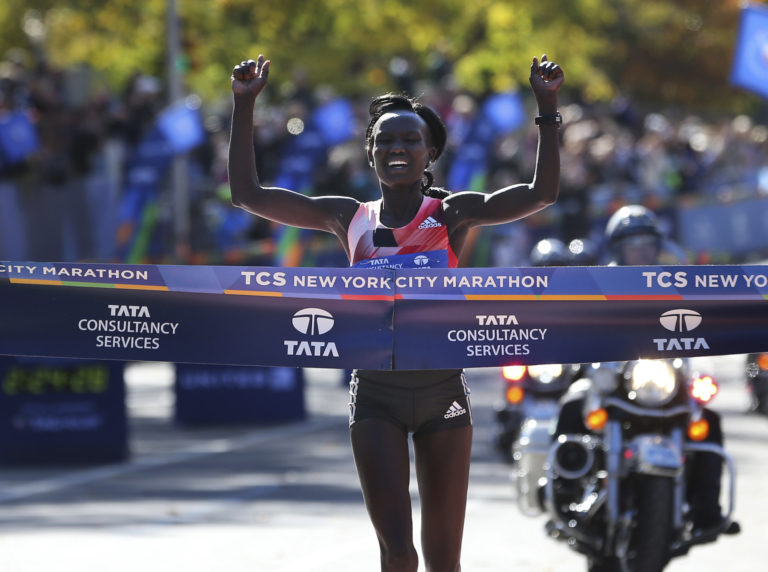 Mary Keitany of Kenya crosses the finish line first in the women's division of the 2016 New York City Marathon in New York, Sunday, Nov. 6, 2016.