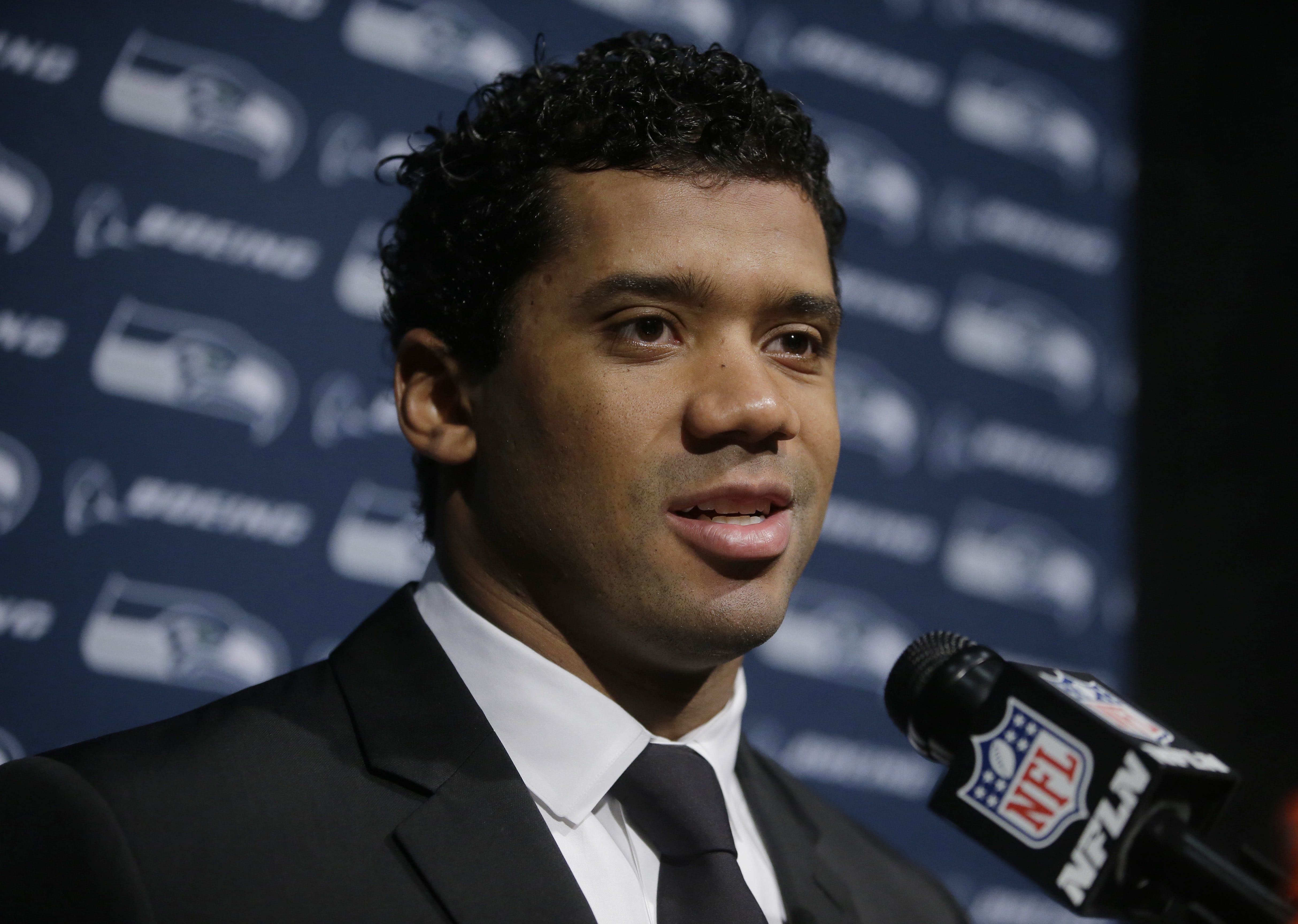 Seattle Seahawks quarterback Russell Wilson speaks to the media following an NFL football game against the New England Patriots, Monday, Nov. 14, 2016, in Foxborough, Mass.