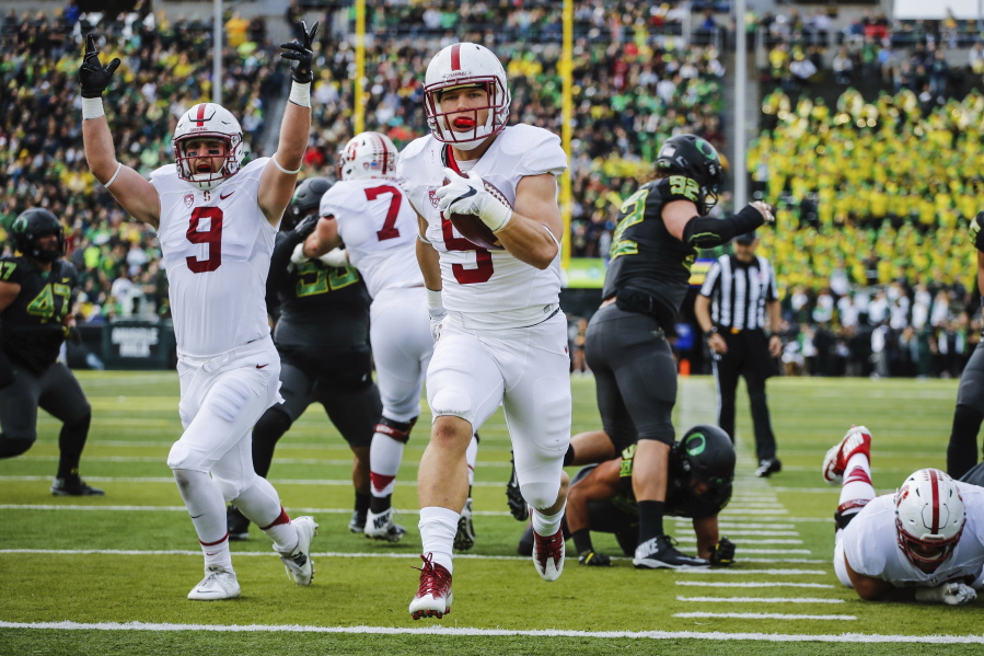 Stanford running back Christian McCaffrey (5) scores his second touchdown in the first quarter of an NCAA college football game Saturday, Nov. 12, 2016, in Eugene, Ore.