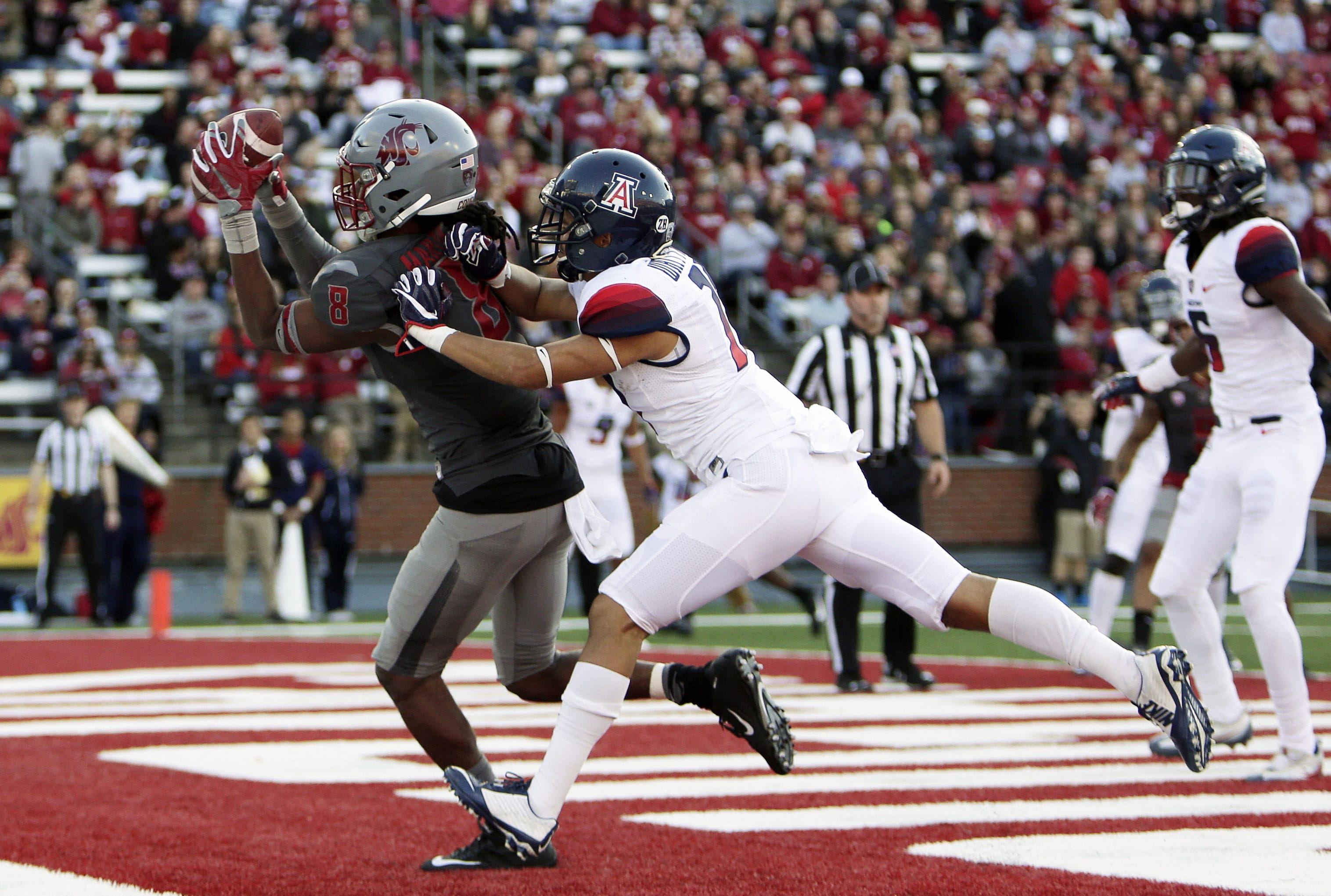 Washington State wide receiver Tavares Martin Jr. (8) catches a pass for a touchdown while defended by Arizona cornerback Jace Whittaker.