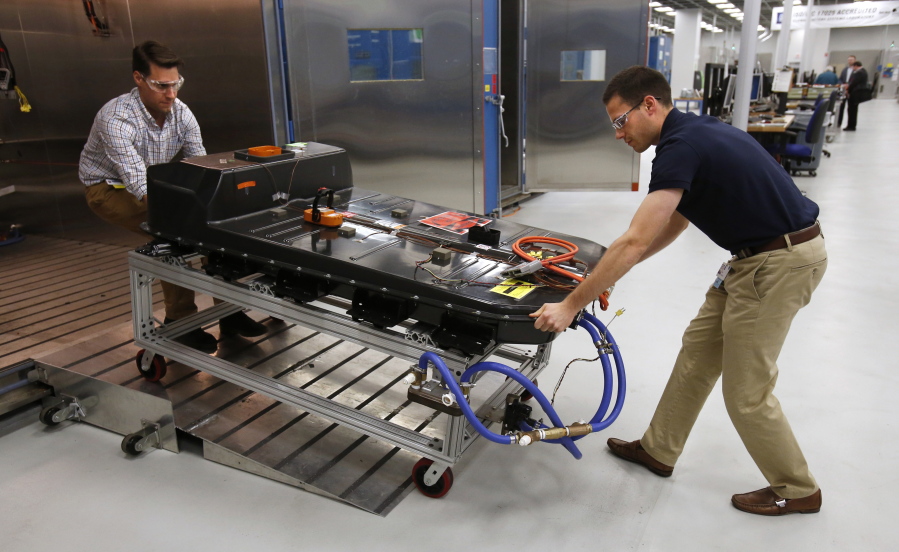 A Chevrolet Bolt EV battery pack is removed for testing Nov. 4 after undergoing charging and discharging cycles at General Motors Warren Technical Center&#039;s Advanced Energy Center in Warren, Mich. The Bolt is the first electric car to get more than 200 miles per charge and fit most buyers&#039; budgets.