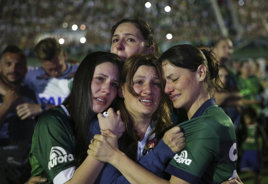 Relatives of Chapecoense soccer players who died in Monday&#039;s crash cry during a memorial inside Arena Condado stadium Wednesday in Chapeco, Brazil.
