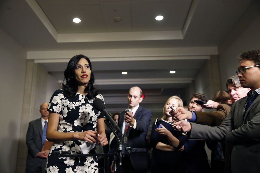 Huma Abedin, a longtime aide to Hillary Rodham Clinton, speaks to the media after testifying at a closed-door hearing of the House Benghazi Committee, on Capitol Hill in Washington. The longtime Hillary Clinton aide at the center of a renewed FBI email investigation testified under oath four months ago she never deleted old emails, despite promising in 2013 not to take sensitive files when she left the State Department.