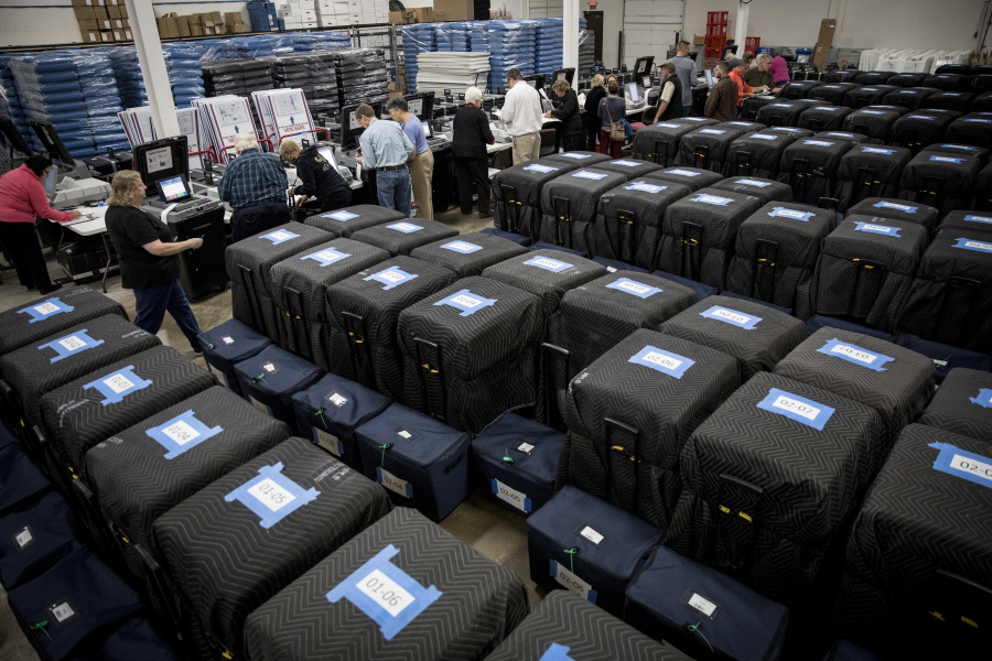 Ballot tabulator machines are checked twice before election judges perform a public accuracy test at the Minneapolis Elections &amp; Voters Services equipment warehouse on Tuesday, Nov. 1, 2016, in Minneapolis.