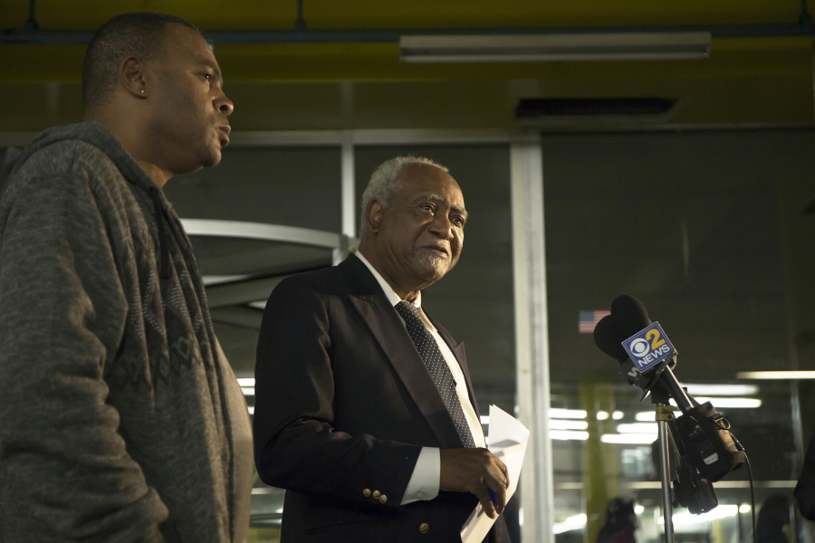 In this Friday, Nov. 18, 2016 photo, U.S. Rep. Danny Davis, D-Ill., center, and his son, Stacey Wilson, give a news conference at the 5th District police department in the Englewood neighborhood of Chicago. Fifteen-year-old Javon Wilson, the grandson of Danny Davis and son of Stacey Wilson, was shot and killed Friday evening. Javon was a sophomore at Perspective high school.