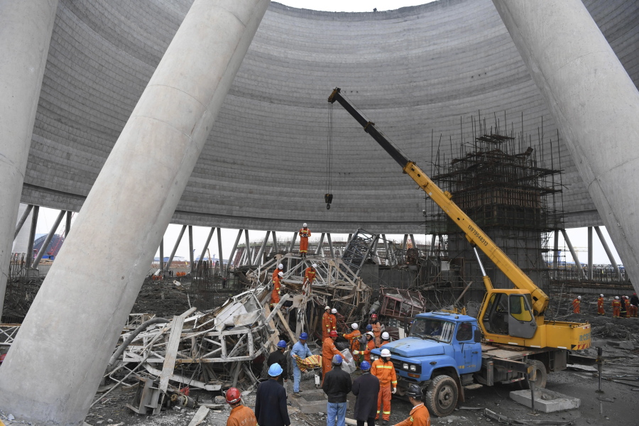 Rescue workers look for survivors after a work platform collapsed at the Fengcheng power plant in eastern China&#039;s Jiangxi Province, Thursday, Nov. 24, 2016. State media reported dozens were killed after the scaffolding tumbled down.