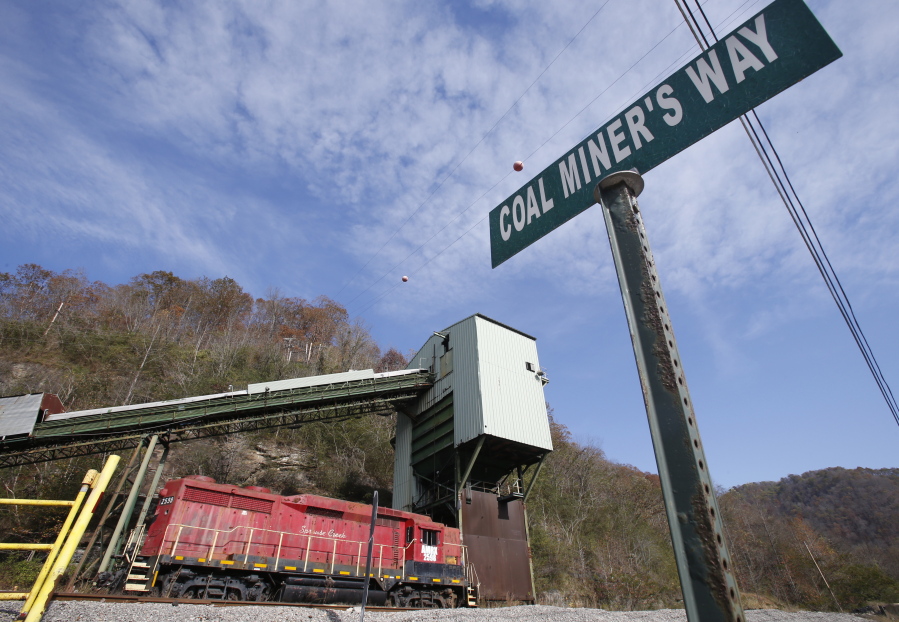 A road sign is posted at the entranced the closed Spruce Creek coal mine in Matewan, W.Va., on Friday. The hard-eyed view along the Tug Fork River in coal country is that Donald Trump has to prove he&#039;ll help Appalachian mining like he promised.