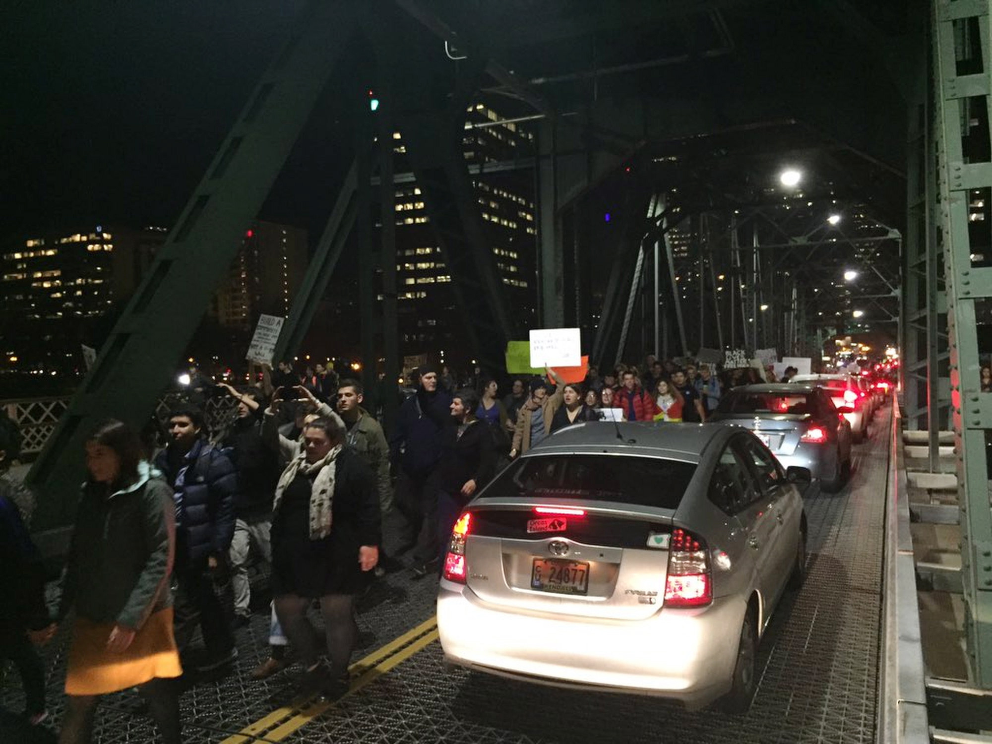 Protesters cross the Hawthorne Bridge in Portland, Ore., on the third day of protests over the results of the 2016 U.S. presidential election, Thursday, Nov. 10, 2016. President-elect Donald Trump fired back on social media after demonstrators in both red and blue states hit the streets for another round of protests, showing outrage over the Republican's unexpected win.