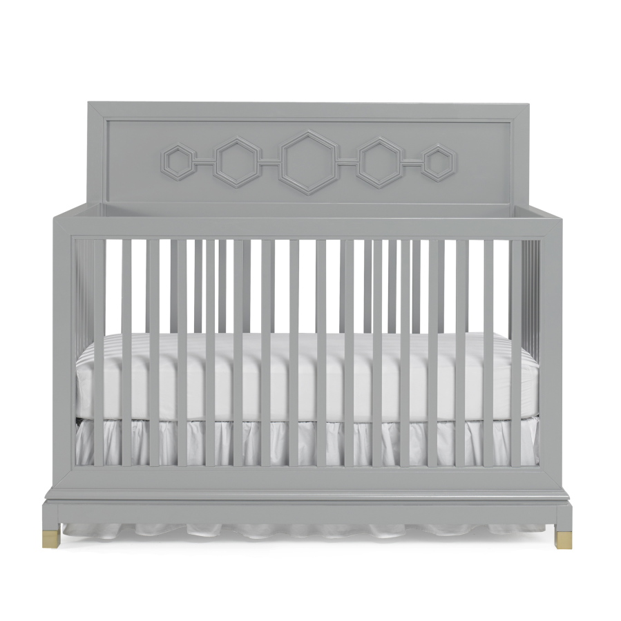 Fisher-Price
A crib designed by Jonathan Adler. The designer&#039;s signature honeycomb motif graces a convertible crib that features Ming inspired capped feet and is available in grey with brass or white with nickel. (Fisher-Price)